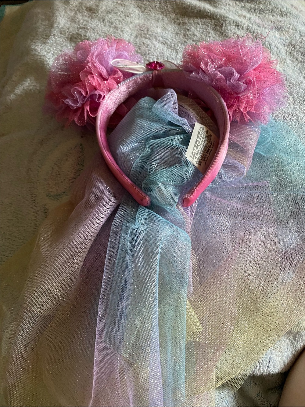 This is a Disney Parks authentic Fairies Minnie Mouse Ears headband with veil.